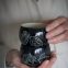 Man holding two cacao mugs