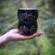 Holding 2 handmade cacao mugs