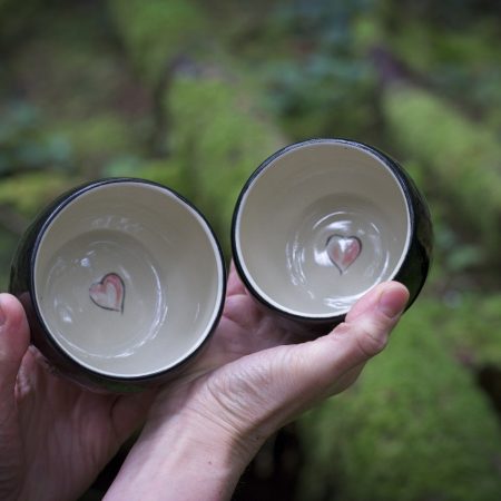 Cacao mugs in forest Inside of our handmade cacao mug, showing a heart at the bottom of the mug