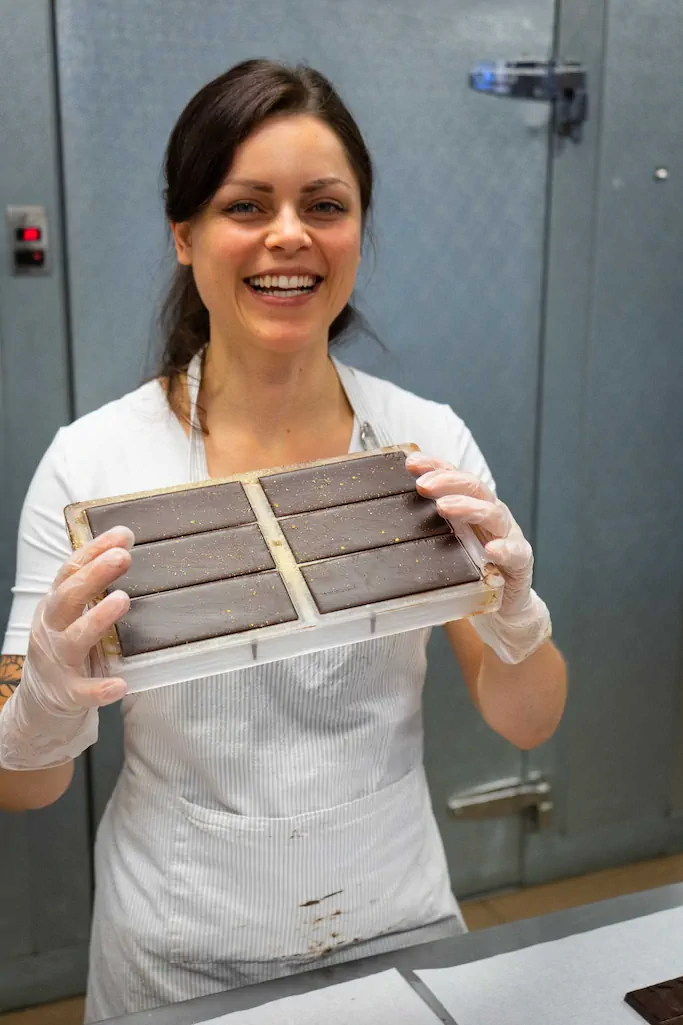Sustainability 5 Mara holding chocolate in tray
