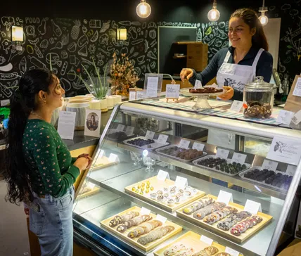 Home 30 mara and a happy customer at the good chocolatier cacao bar at greens organic market